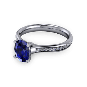 Oval sapphire commitment ring with accent set shoulders