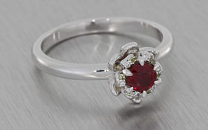 Round Ruby Diamond Ring set with Grain set Petals and Complemented with Accent Peridots