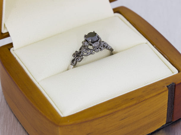 Gothic style ring set with black diamonds with scroll work and skull ...