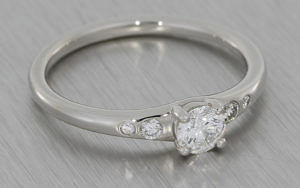 Contemporary platinum engagemenet ring set with brilliant cut white diamonds