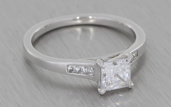 Silver proposal ring set with a square cubic zirconia with smaller ...