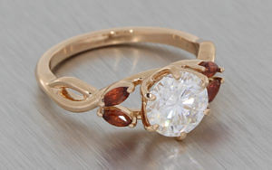 Round Moissanite And Marquise Shape Garnet Ring With An Alluring Twisted Band