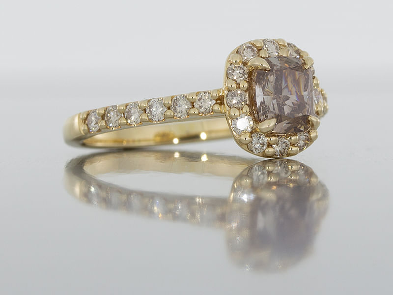 durham rose yellow gold ring set with a centre cognac diamond surrounded with a champagne diamond halo