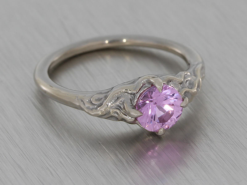 durham rose organic molten texture ring set with a pale pink sapphire main